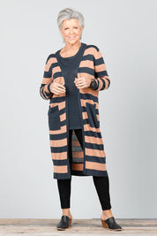 A model wearing the St Moritz Stripe Cardigan in colour Charclay (Grey), from the front, showing the whole outfit