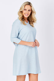 Model Jess wearing size M of the Gela Dress in colour Sky (Blue), from the front, cropped image