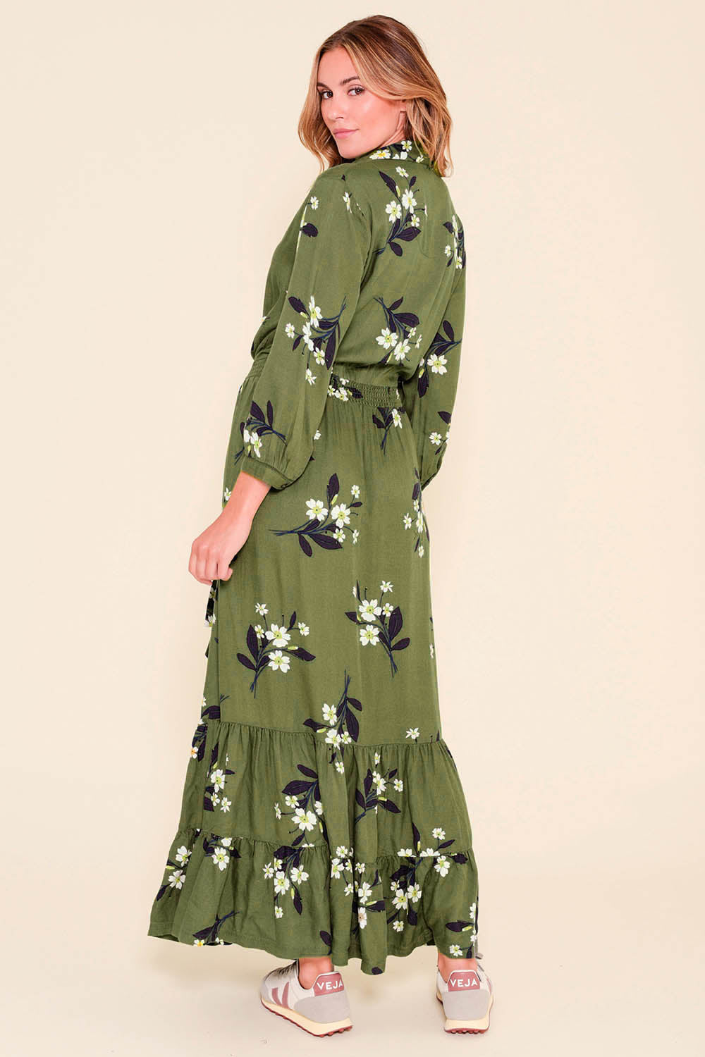 A model wearing the Preloved Primrose Olive Maxi Shirt Dress in colour Green (Green), from the back