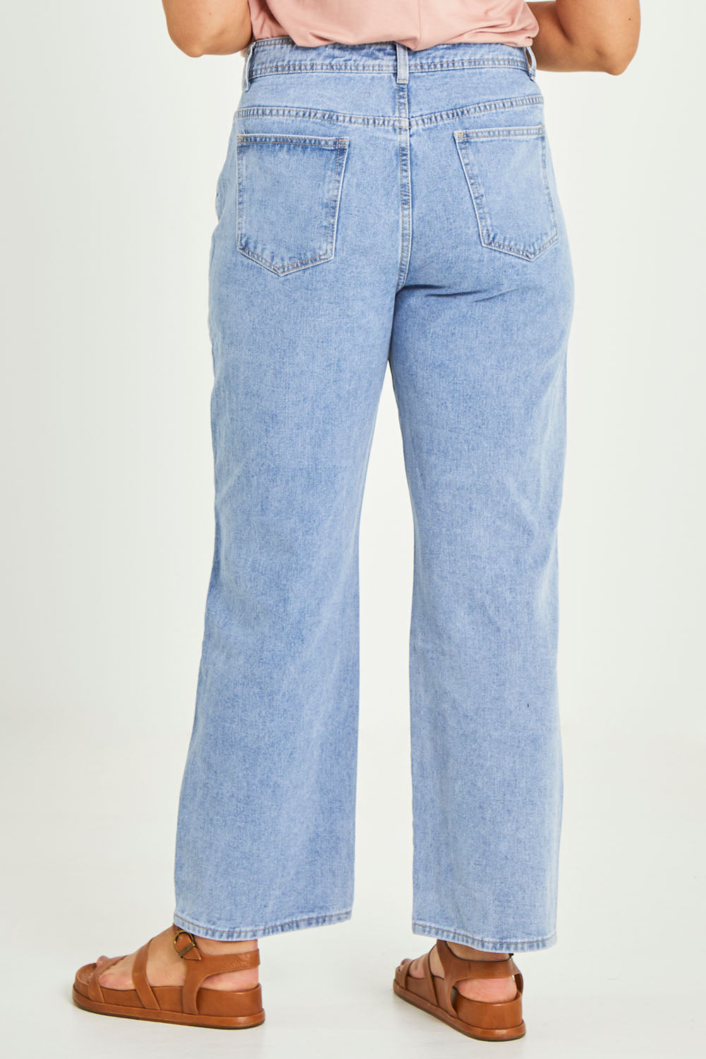 Model Terri-Leigh wearing size 14 of the Taylor Straight Jean in colour Midblue (Blue), from the back