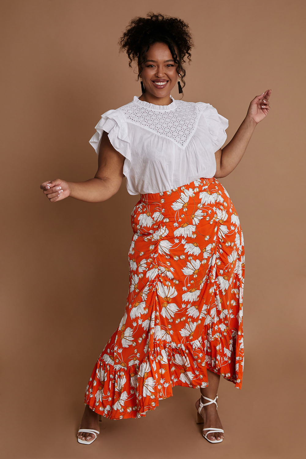 Model Alexis wearing size XL of the Free Love Skirt in colour Sundance, from the front, showing the whole outfit