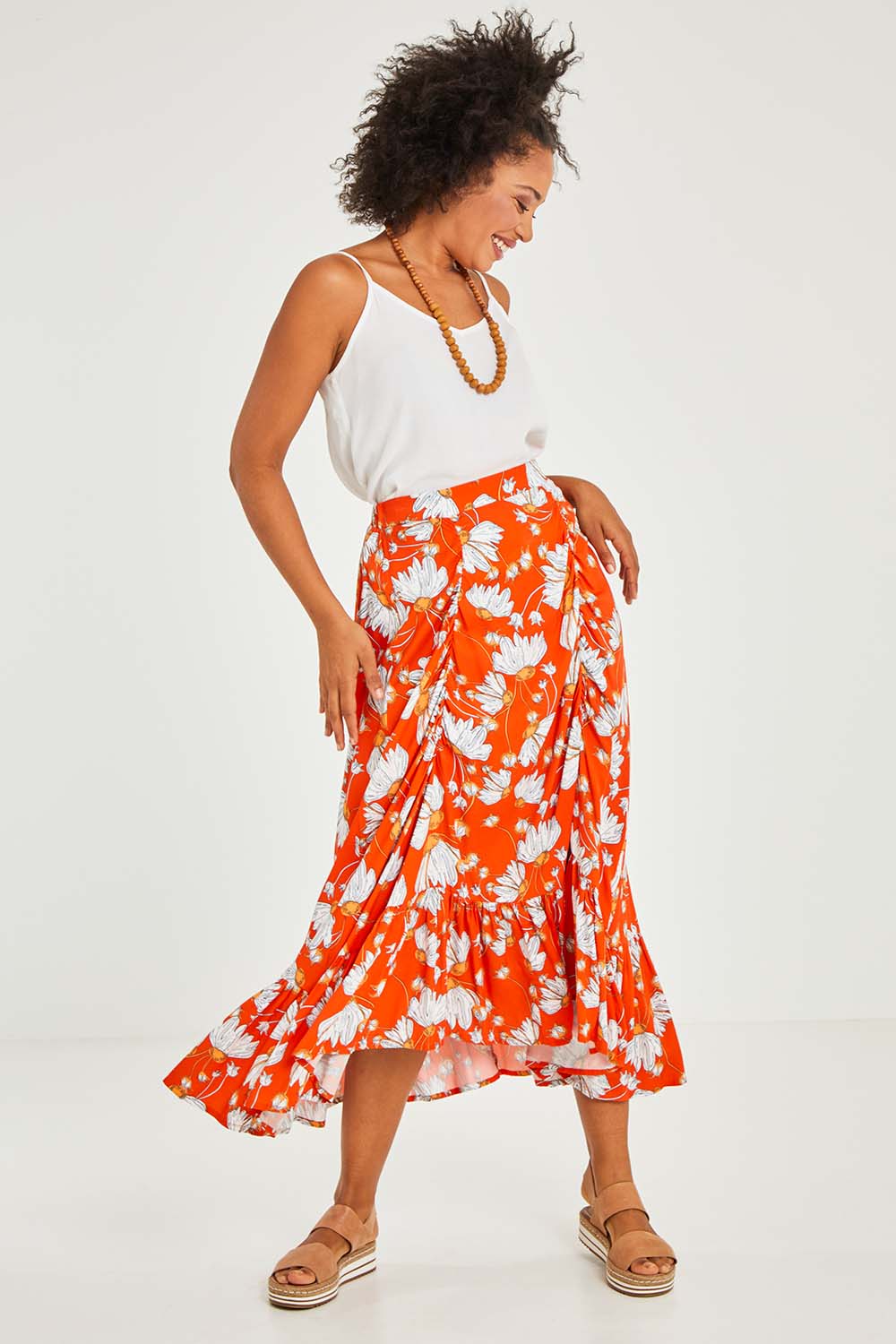 Model Olivia wearing size S of the Free Love Skirt in colour Sundance, from the front, showing the whole outfit