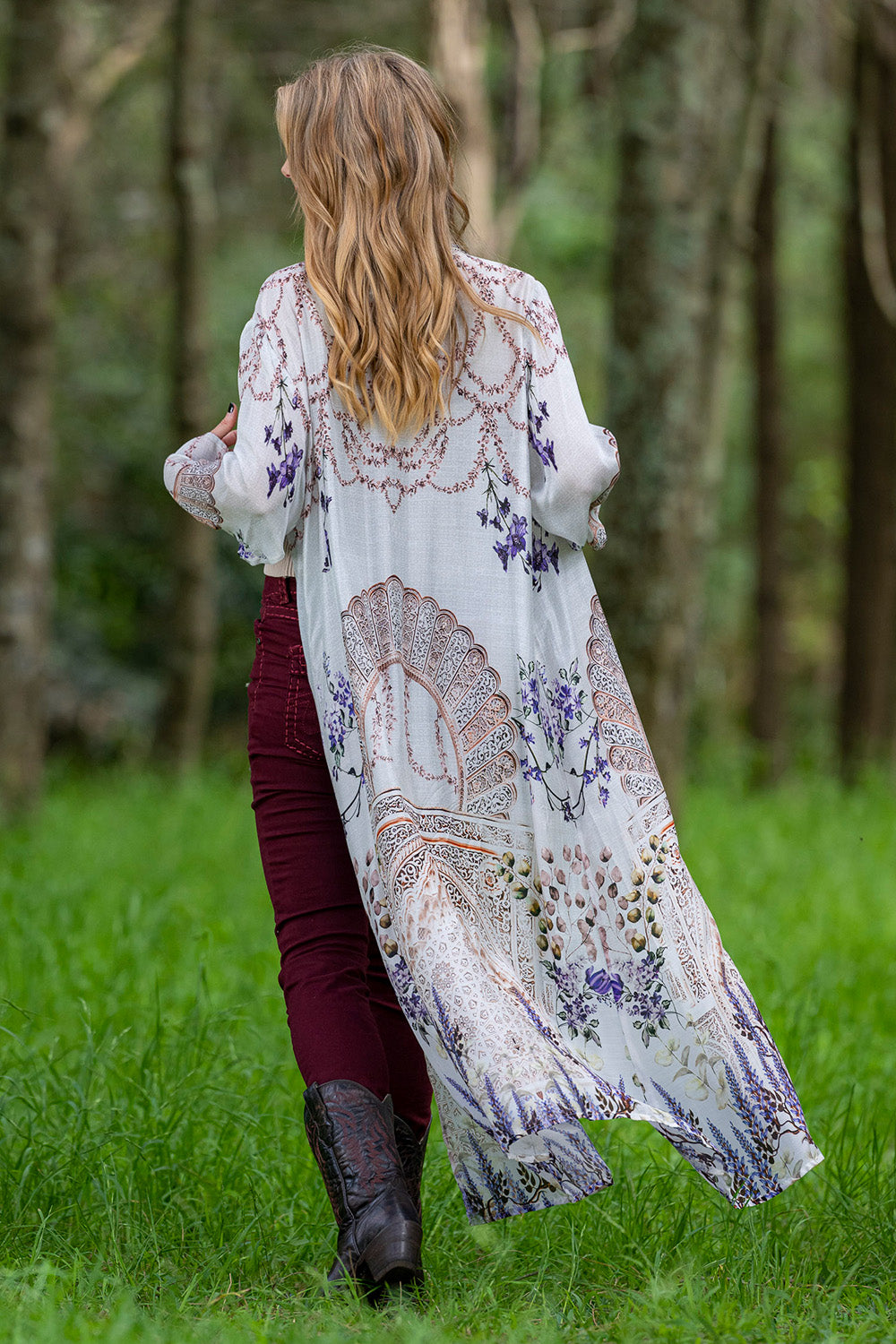 A model wearing the Lavender Duster in colour Lavender (White), from the back