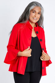 Model Nadine wearing size S of the Crimson Button Jacket in colour Red (Red), from the front, cropped image