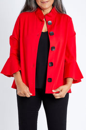Model Nadine wearing size S of the Crimson Button Jacket in colour Red (Red), from the front, cropped image