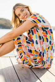 Model Phoebe wearing size S of the Abstract Print Dress in colour Multi (Blue), from the front, showing the whole outfit