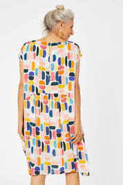 Model Rachel wearing size S of the Abstract Print Dress in colour Multi (Blue), from the back