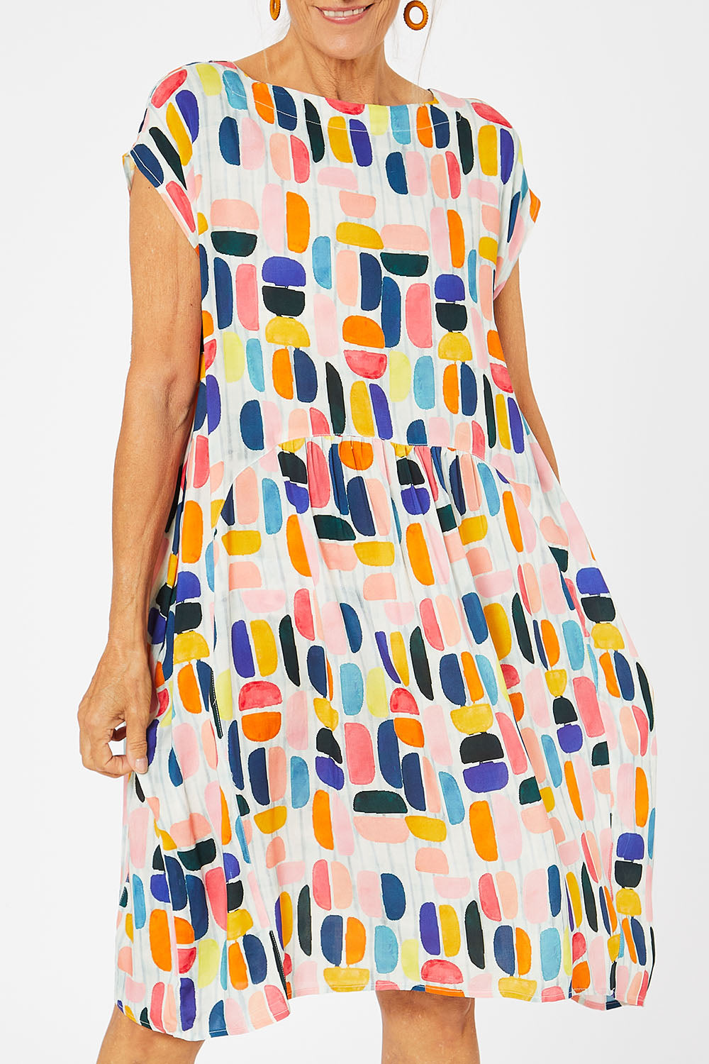 Model Rachel wearing size S of the Abstract Print Dress in colour Multi (Blue), from the front, cropped image