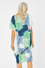 Model Rachel wearing size S of the Pocket Print Dress in colour Multi (Green), from the back