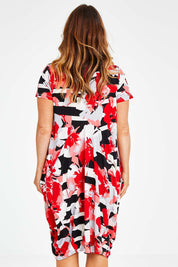 Model Laura wearing size 14 of the Cap Sleeve Bounce Dress in colour Red (Red), from the back