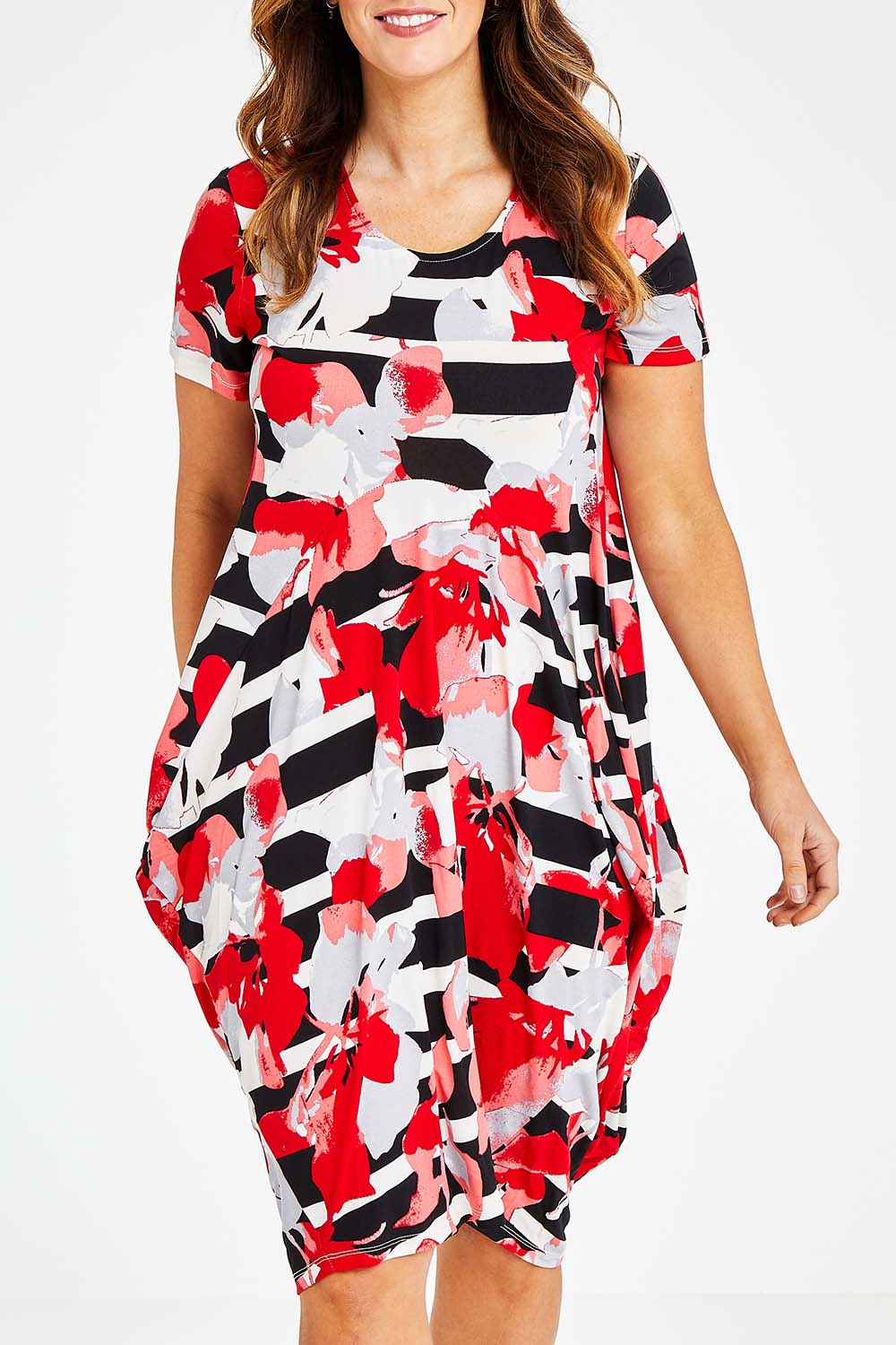 Model Laura wearing size 14 of the Cap Sleeve Bounce Dress in colour Red (Red), from the front, cropped image