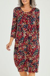 Model Luisa wearing size 10 of the Box Pleat Dress in colour Multiprint (Black), from the front, cropped image