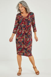 Model Luisa wearing size 10 of the Box Pleat Dress in colour Multiprint (Black), from the front, showing the whole outfit