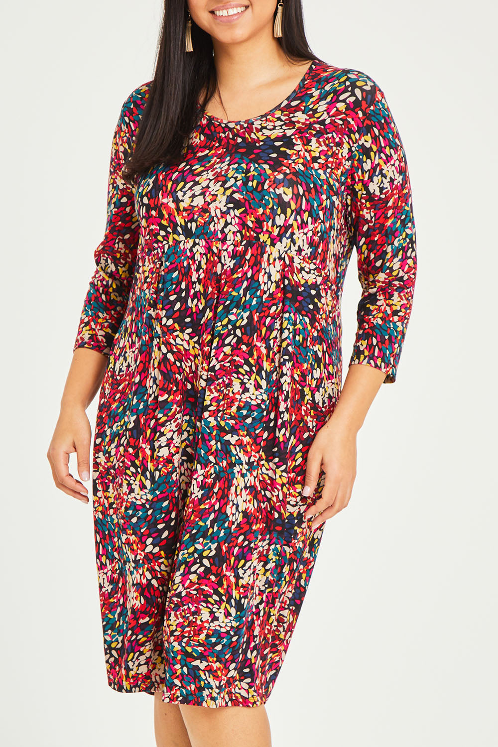 Model Terri-Leigh wearing size 14 of the Box Pleat Dress in colour Multiprint (Black), from the front, cropped image