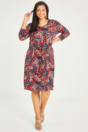 Model Terri-Leigh wearing size 14 of the Box Pleat Dress in colour Multiprint (Black), from the front, showing the whole outfit