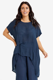 Model Laura wearing size M-L of the Snow Drop Hi Low Top in colour Slate (Grey), from the front, cropped image