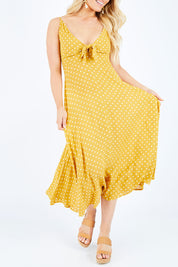 Model Hayley wearing size S of the Zuma Maxi in colour Saffron, from the front, cropped image
