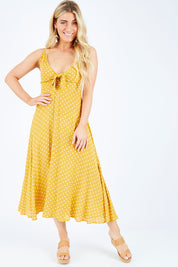 Model Hayley wearing size S of the Zuma Maxi in colour Saffron, from the front, showing the whole outfit
