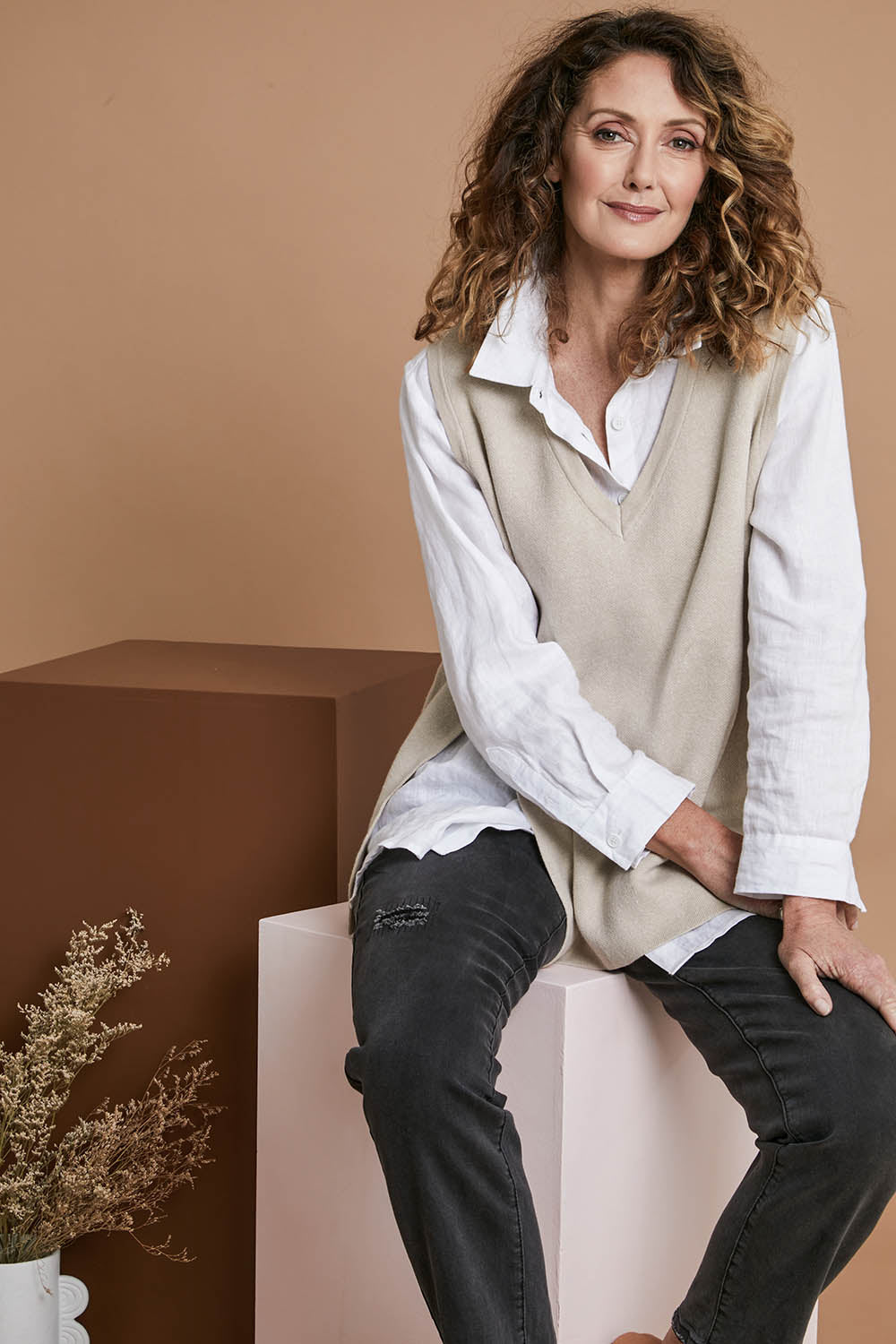 Model Emma wearing size S of the Cleo Vest in colour Oat, from the front, showing the whole outfit