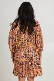 Model Katie wearing size S of the Mayan Dress in colour Ochre, from the back
