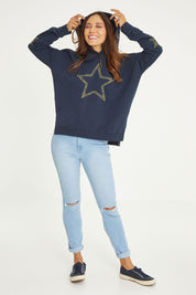 Model Cara wearing size 10 of the Hi Rider in colour Astral (Blue), from the front, showing the whole outfit