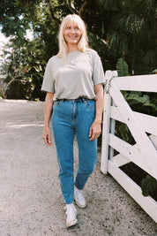 A model wearing the Hi Mom Curve in colour Blissblue (Blue), from the front, showing the whole outfit