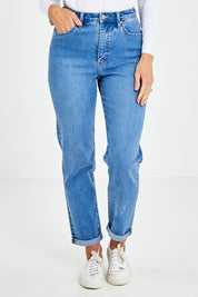 Model Kelly wearing size 10 of the Hi Mom Curve in colour Blissblue (Blue), from the front, cropped image