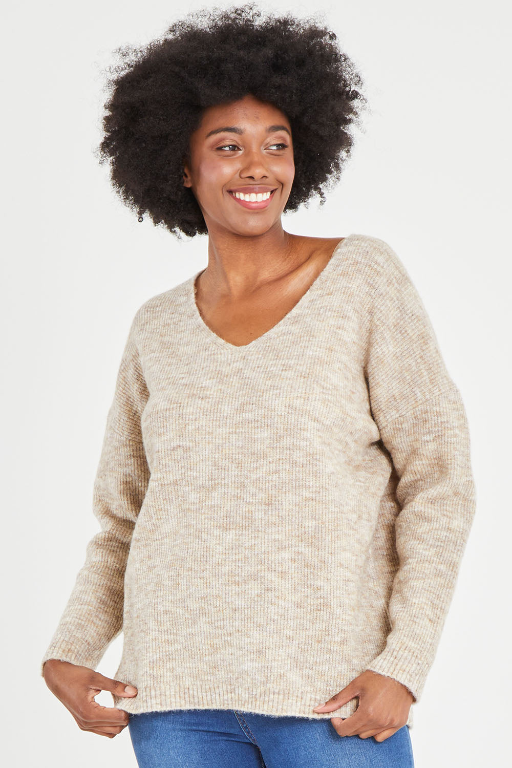 Model Aiyana wearing size S of the Verity V Neck Knit in colour Oatmeal, from the front, cropped image