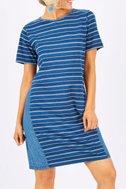 Model Emma wearing size 10 of the Frankie Dress in colour Indigo (Blue), from the front, cropped image