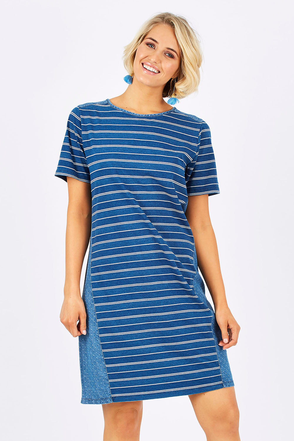 Model Emma wearing size 10 of the Frankie Dress in colour Indigo (Blue), from the front, cropped image