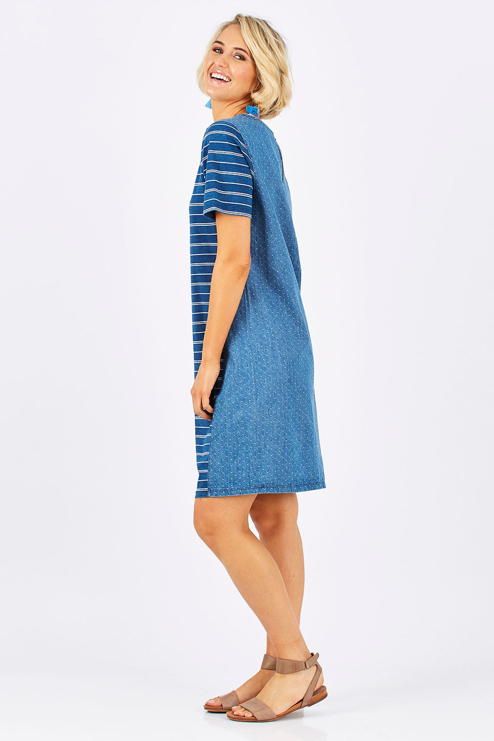 Model Emma wearing size 10 of the Frankie Dress in colour Indigo (Blue), from the front, showing the whole outfit