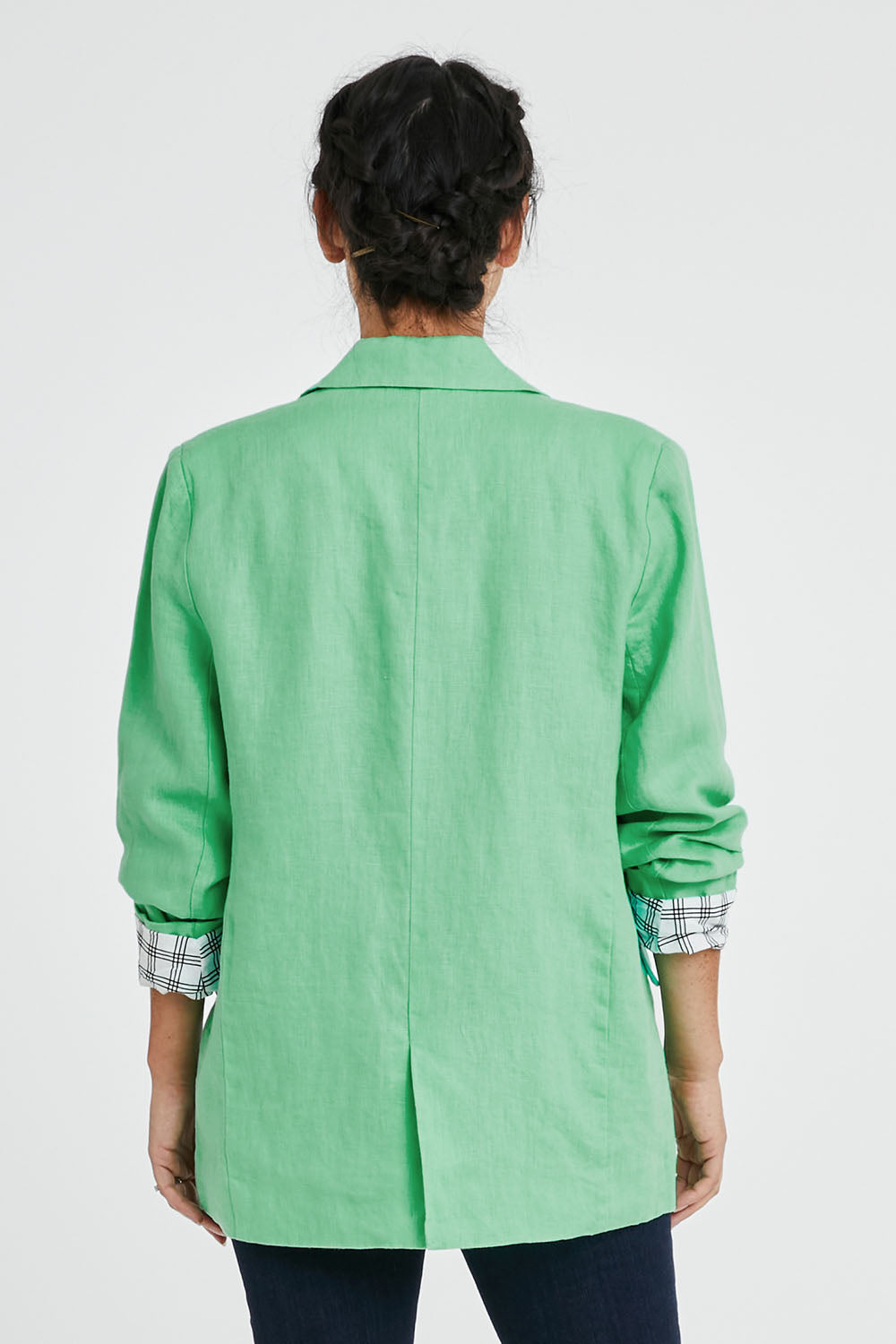Model Katie wearing size 10 of the Millie Blazer in colour Blimegree (Green), from the back