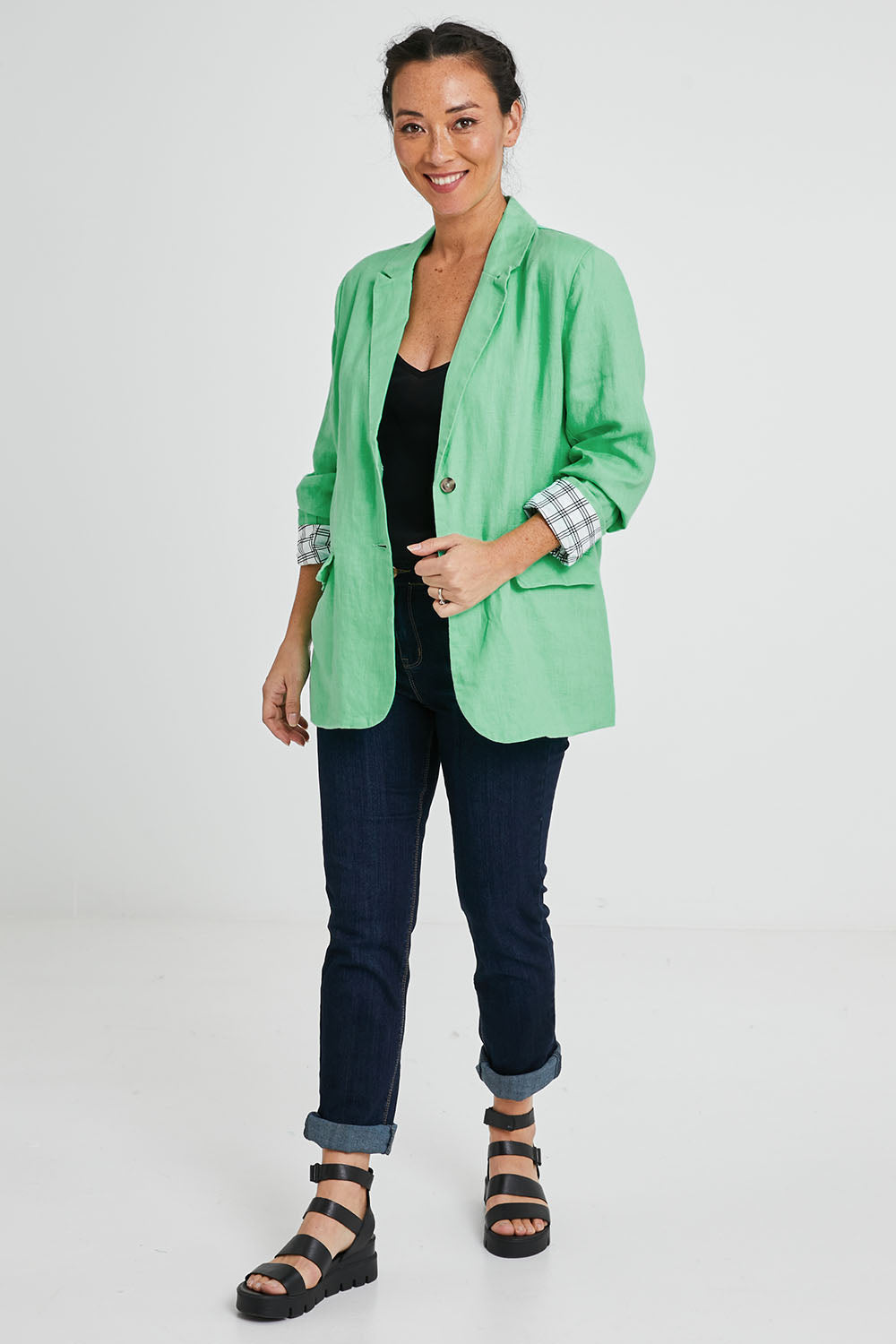 Model Katie wearing size 10 of the Millie Blazer in colour Blimegree (Green), from the front, showing the whole outfit