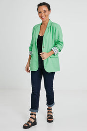 Model Katie wearing size 10 of the Millie Blazer in colour Blimegree (Green), from the front, showing the whole outfit