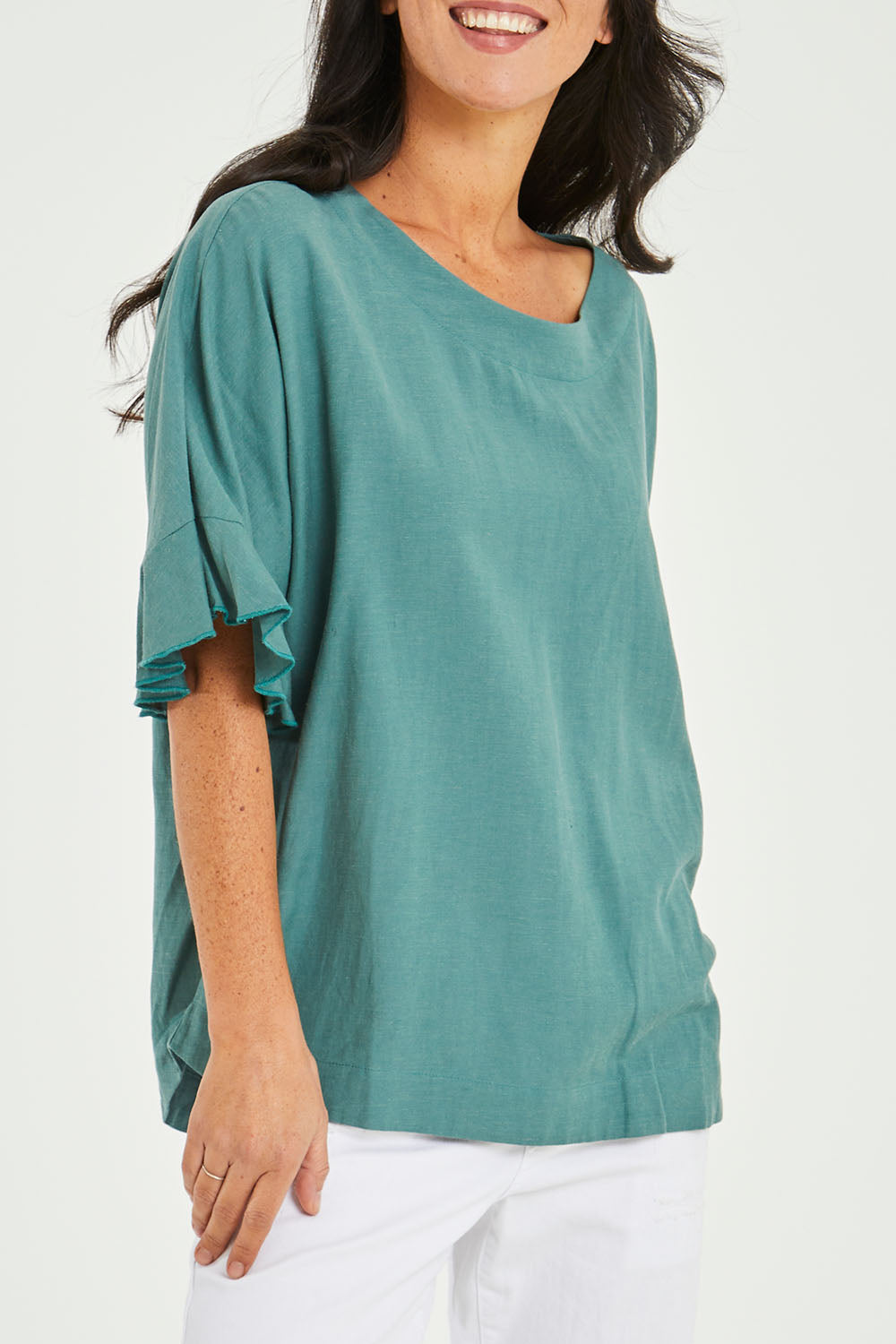 Model Katie wearing size 10 of the Miranda Top in colour Rosemary (Green), from the front, cropped image