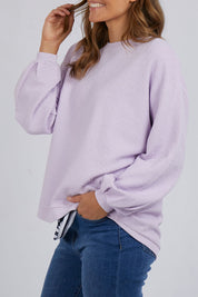 A model wearing the Piper Sweat in colour Lilac (Purple), from the front, cropped image