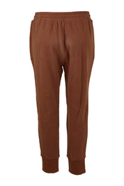 Product shot of the Fundamentals Cosy Track Pant in colour Choc, from the back