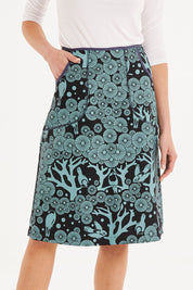 Model Madeline wearing size S of the Avril Skirt Long Mikko in colour Greenink (Blue), from the front, cropped image
