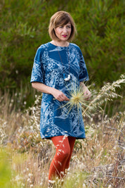 A model wearing the Lark French Tunic in colour BlueSilver (Blue), from the front, showing the whole outfit