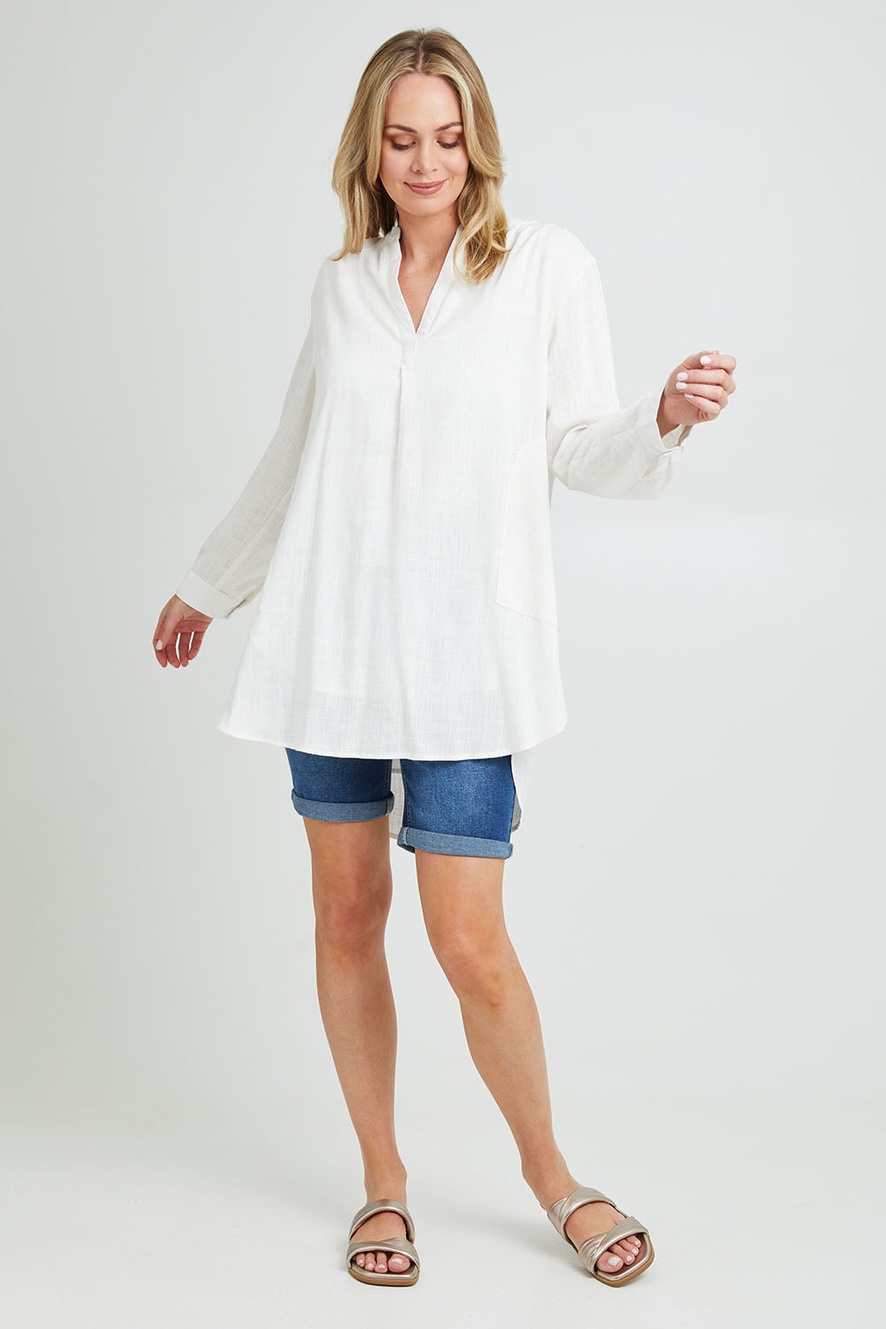 Model Grace wearing size 10 of the Beach Tunic Shirt in colour White (White), from the front, showing the whole outfit