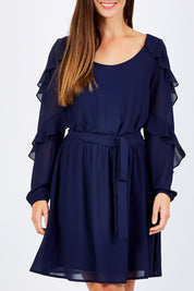 Model Anna wearing size 10 of the Eugenie Dress in colour Ink (Blue), from the front, cropped image