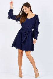 Model Anna wearing size 10 of the Eugenie Dress in colour Ink (Blue), from the front, showing the whole outfit