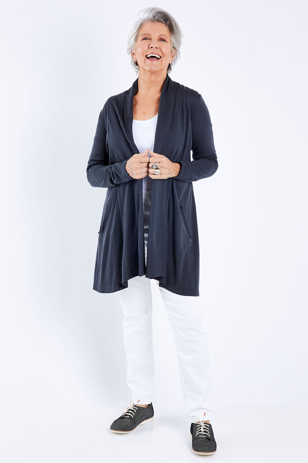 Model Elise wearing size S of the Living Large Merino Swing Cardi in colour Thunder (Grey), from the front, showing the whole outfit