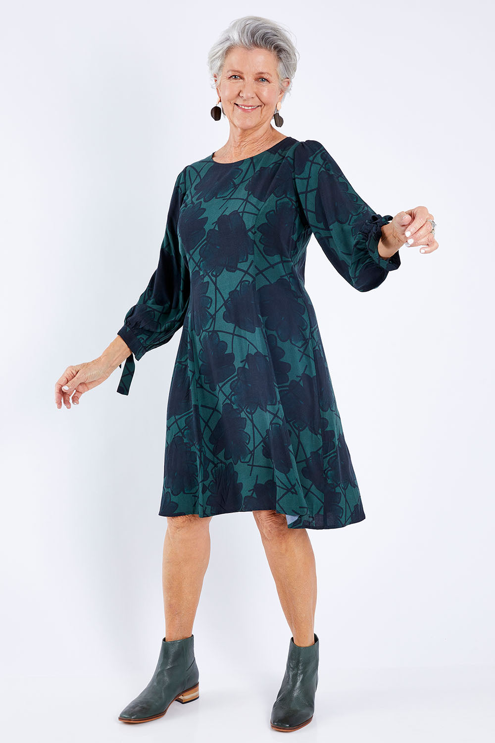 Model Elise wearing size 10 of the All Tied Up Dress in colour Slatefrond (Black), from the front, showing the whole outfit