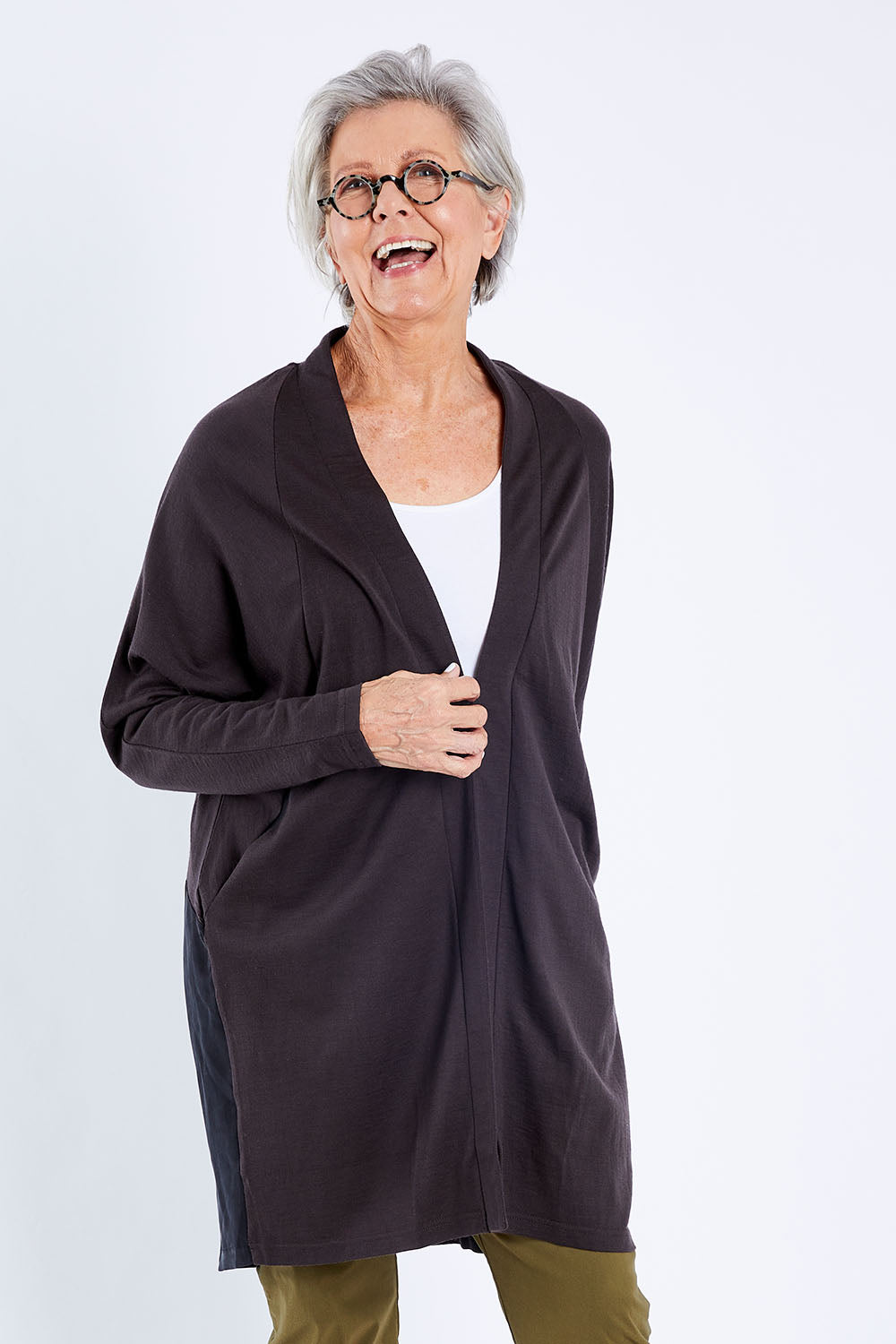 Model Elise wearing size S of The Break Out Cardi in colour Espressobl (Black), from the front, cropped image