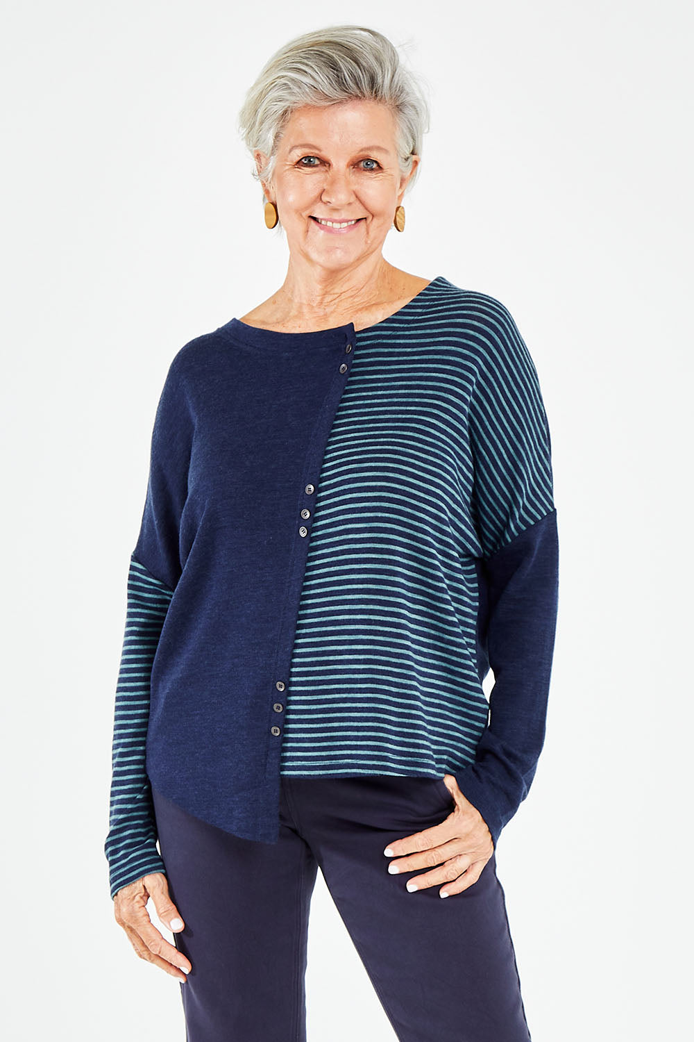Model Elise wearing size S of the Two Times The Fun Merino Sweater in colour Navyspear (Blue), from the front, cropped image