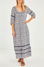 Model Kelly wearing size 10 of the High Life Dress in colour Mangotango (Blue), from the front, cropped image