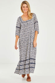 Model Kelly wearing size 10 of the High Life Dress in colour Mangotango (Blue), from the front, showing the whole outfit