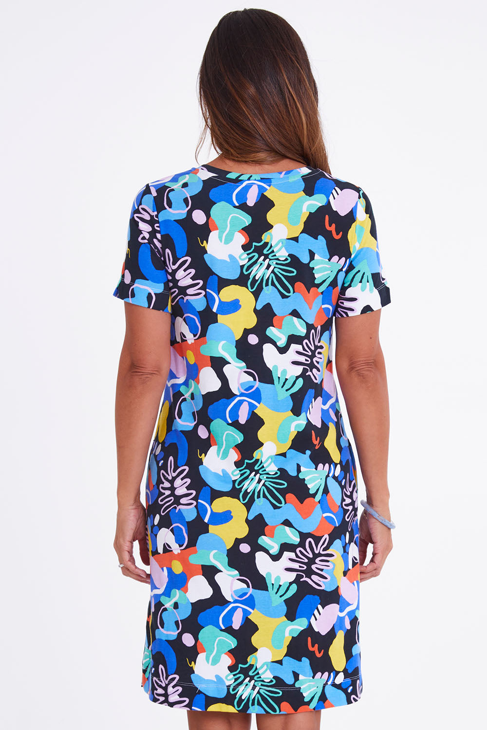 Model Alex wearing size S of the Here Comes Summer Dress in colour Memphis (Blue), from the back