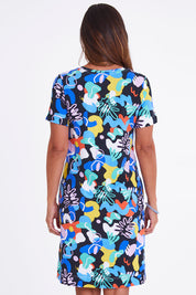 Model Alex wearing size S of the Here Comes Summer Dress in colour Memphis (Blue), from the back